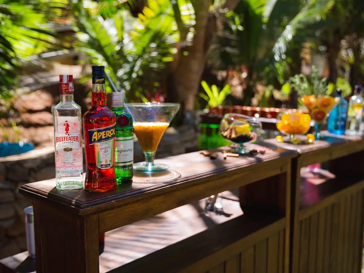 A restored vintage truck converted into a mobile cocktail bar parked at an event